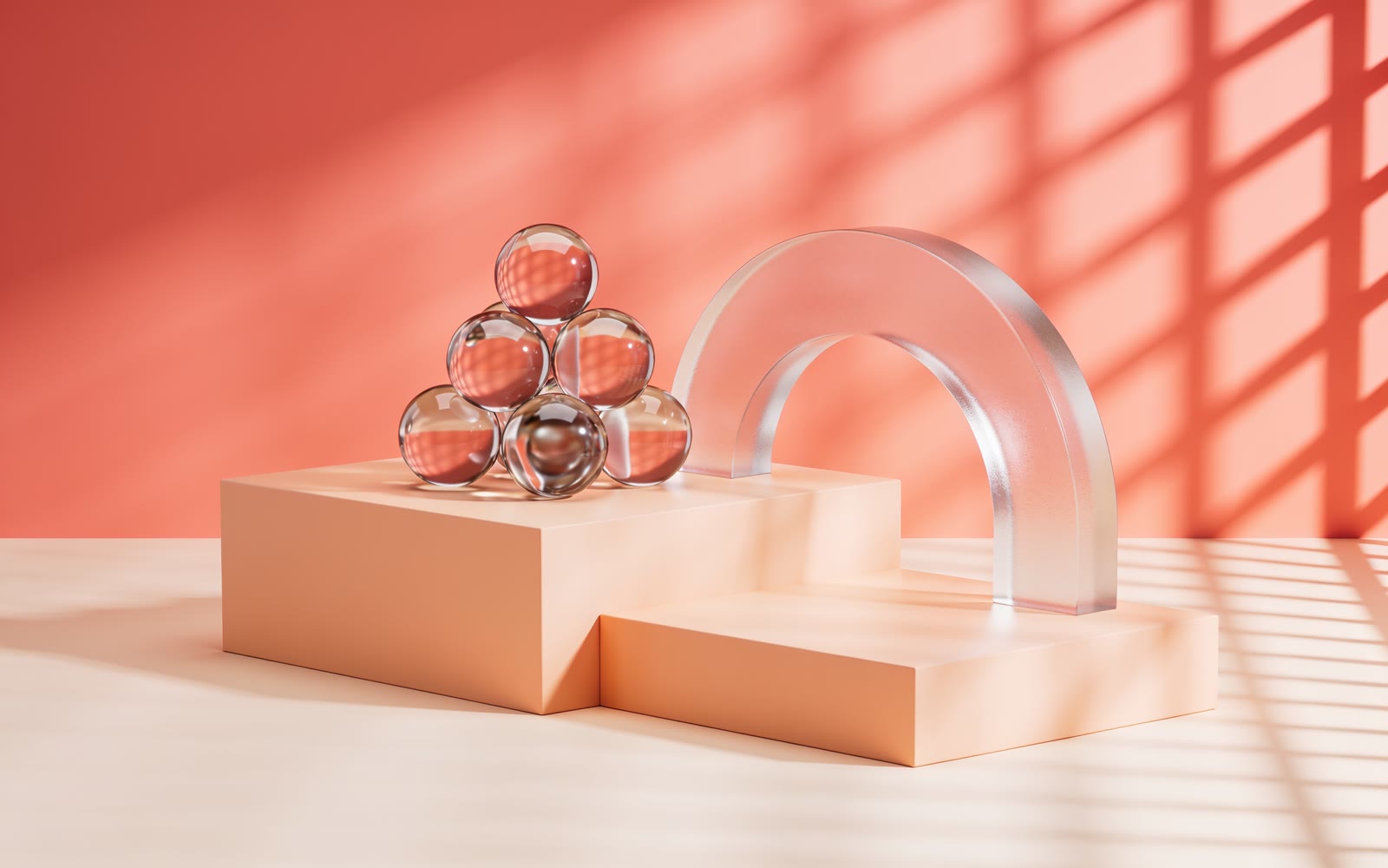 Glass forms arranged on warm peach plinths